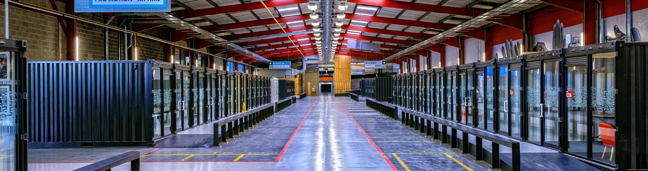 Interior of The Sharp Project in Manchester, with flexible work units arranged along the central production-space aisle